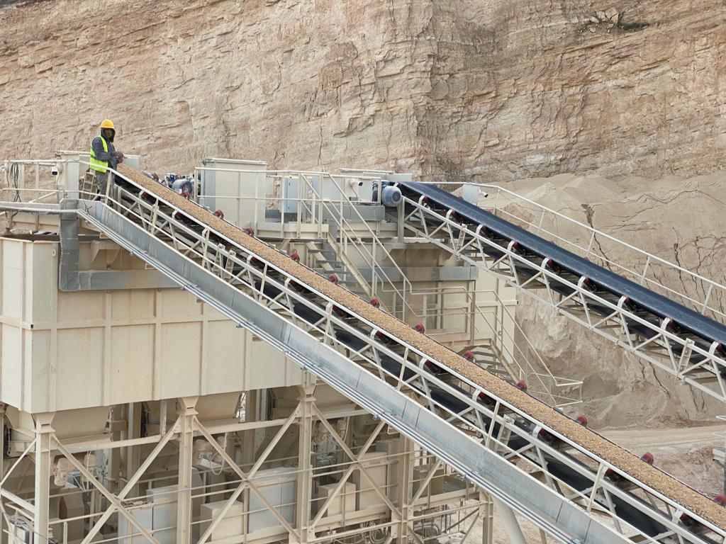 Plant walkway alongside running conveyor